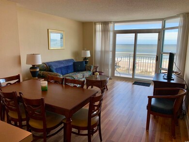 Dining area with hardwood / wood-style floors, flo