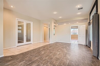 Entry living/dining room.  Adjacent room with fren