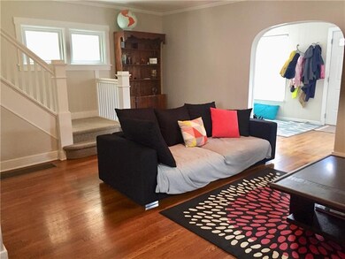 Spacious living room with hardwood floors.