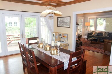 Formal dining room looks into the kitchen and livi