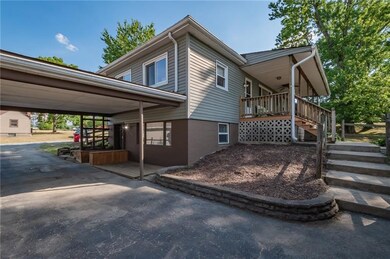 View of covered parking and back porch