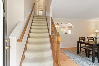 From the front entryway, the dining room is to you