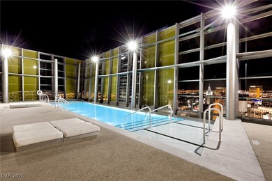 Pool at twilight featuring a community pool