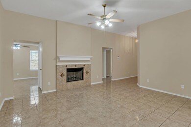 Unfurnished living room with baseboards, a firepla