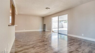 Main living space with new paint, baseboards, floo