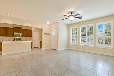 Kitchen with stainless steel microwave, light cou
