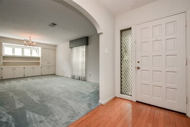 Custom built cabinets and shelves in the dining/living area.