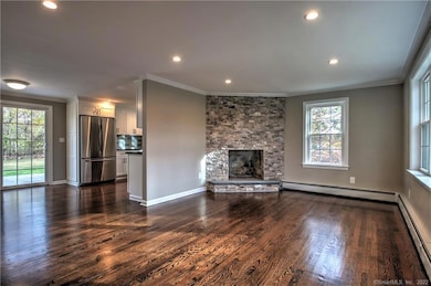 RICH COLOR STAINED HARDWOOD FLOORS AND BEAUTIFUL STONE FIREPLACE ( NOT FOR TENANT USE).