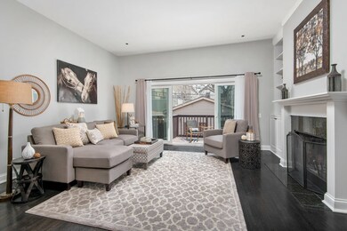 The kitchen opens to a large family room w/ a wood
