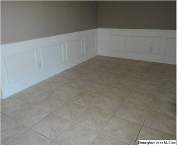 PICTURE MOLDING AND TILE FLOOR IN DINING ROOM