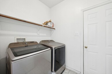 Laundry area with washing machine and clothes drye