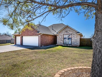 Ranch-style house with a front lawn and a garage