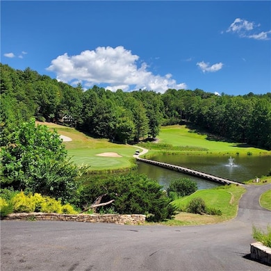 View of home's community featuring a water view an