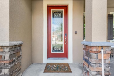 Beautiful leaded glass front door.Stone accents.