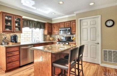 Remodeled kitchen with granite counters and backsp