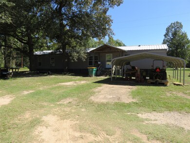 18x76 single wide manufactured home with car port. The home is a three bedroom with 2 full baths and the laundry room is inside.