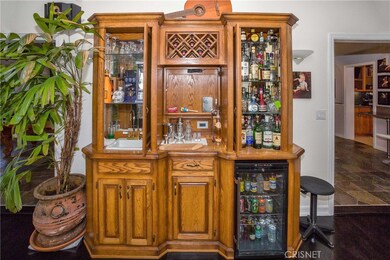 Built-in hutch includes wet bar and refrigerator