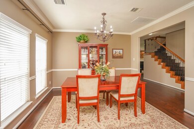 Notice the crown molding and chair rail around the entire dining and living room area.