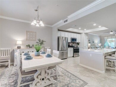 Tiled dining space with ceiling fan with notable c
