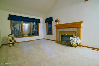 living room with gas fireplace insert
