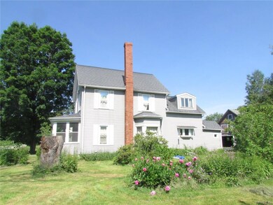 Side view of house showing some of the flower gard