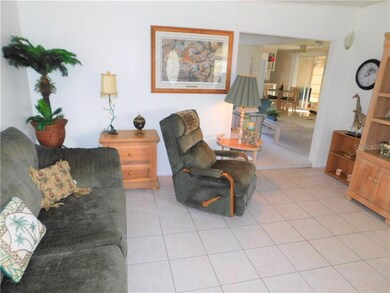 Bonus living room has tile flooring.