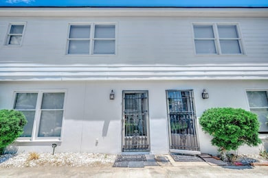 View of exterior entry with stucco siding