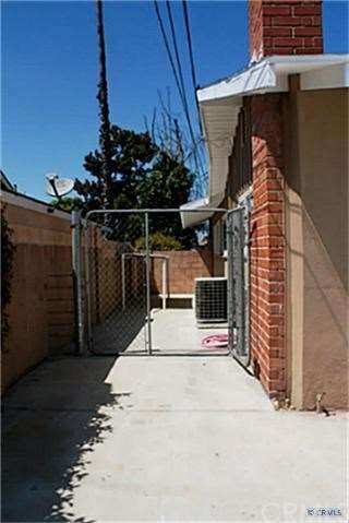 Side yard with dog run.