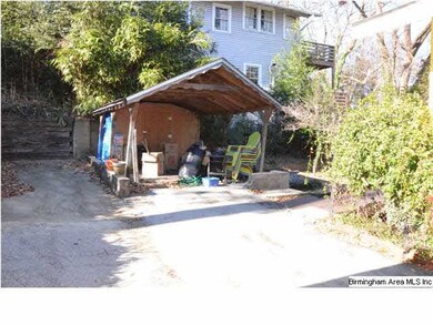 One car carport in back of the home is accessed th