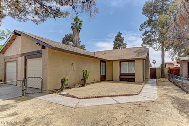 Single story home featuring stucco siding, a gate,