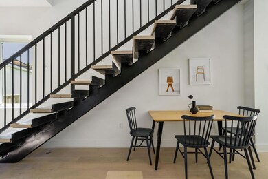 Dining room featuring wood finished floors, baseb