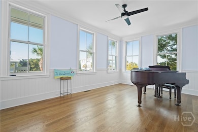 Natural light drenches this dining room / music ro