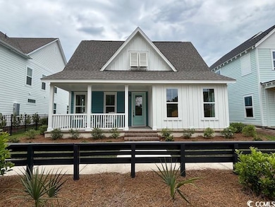 View of front of property with covered porch, boar