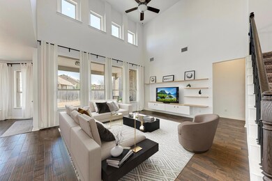 Living area featuring visible vents, dark wood fi