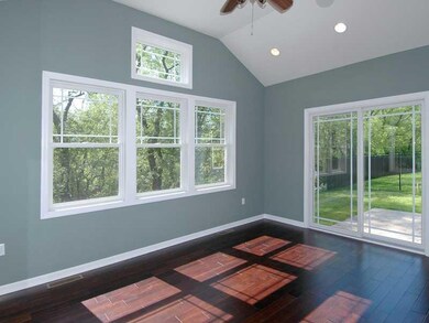 Sunroom. Hardwood floors and access to rear stampe