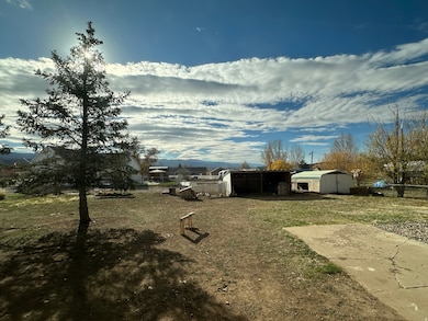 View of yard with storage sheds