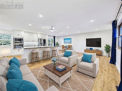 Virtually staged to show a comfortable layout, this open space accommodates both relaxing and dining with ease—perfect for everyday living.