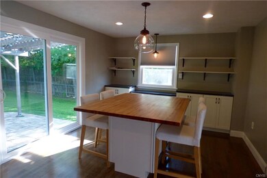Dining area overlooking patio, built-in buffet wit