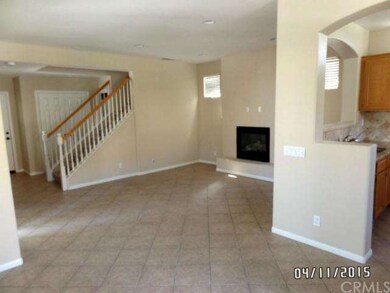 Entry to living room, tile spans the living area f