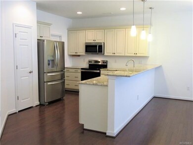 Eat-in Kitchen boasts Gleaming Hardwood Flooring, 