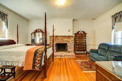 Main Level Bedroom to right of foyer Room is entire width of original house