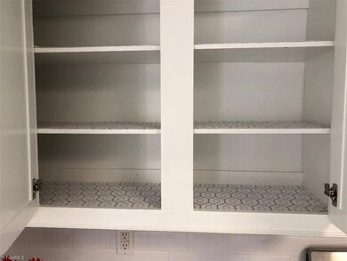 Lined kitchen cabinets ready for move in