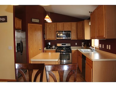 Stainless appliances and large corner pantry.