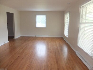 Large living room with hardwood floors.