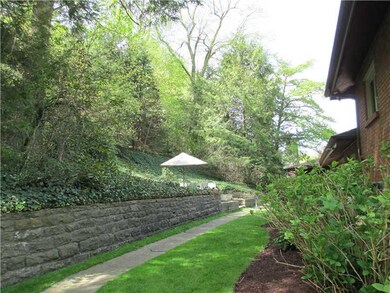 Exterior Front. Raised patio terrace from covered 