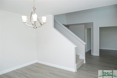 Formal dining room with entry to island kitchen.