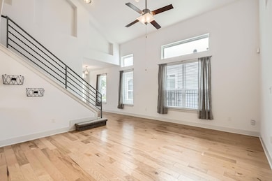 Unfurnished living room with hardwood / wood-styl