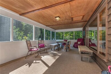 Upstairs screened in front porch view 2