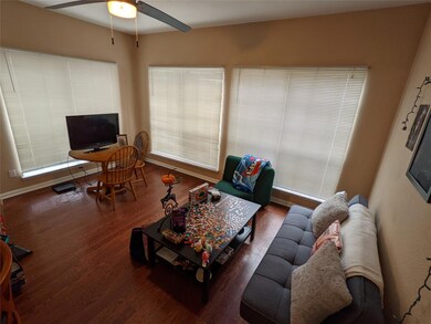 Living area featuring wood finished floors, ceili