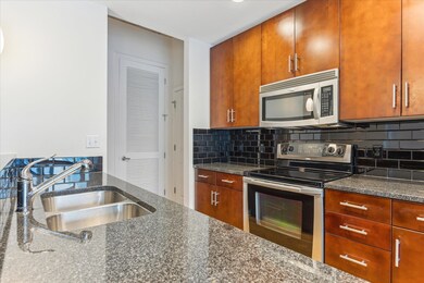 Kitchen featuring appliances with stainless steel